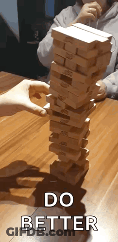 Person Stacking Wooden Blocks GIF