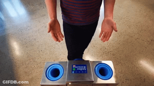Person Standing Before Autoglove Machine GIF