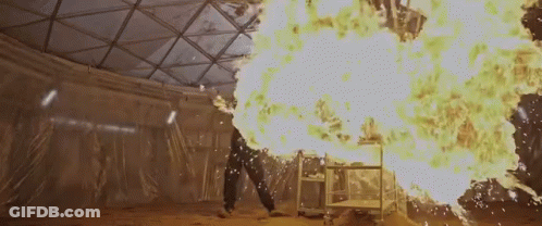 Person Standing Before Fireball GIF