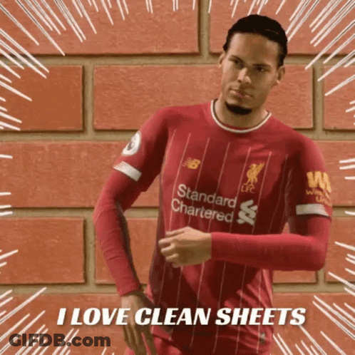Person Standing Before Yellow Curtain In Dark Room GIF