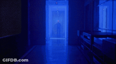 Person Standing In A Hallway GIF