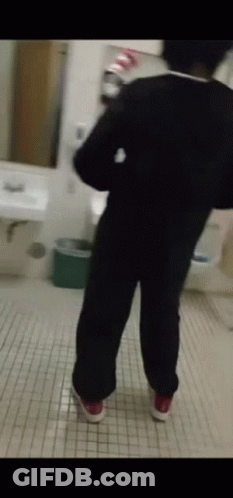 Person Standing In Bathroom GIF