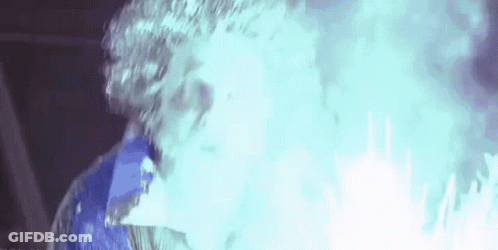 Person Standing In Blue Smoke GIF