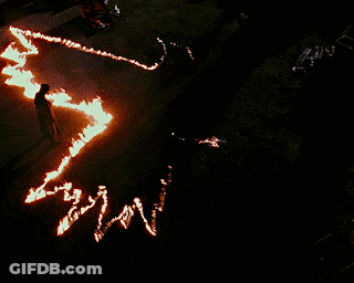 Person Standing In Circle Of Fire Map GIF