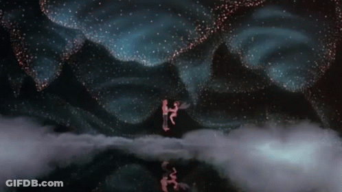 Person Standing In Clouds With Starry Sky GIF