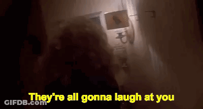 Person Standing In Dark Room With Laughing Words GIF