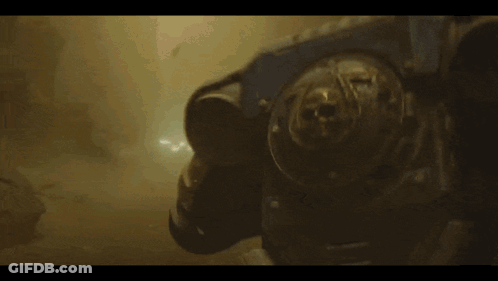 Person Standing In Dark Room With Light Coming Out Of Mouth GIF