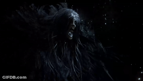 Person Standing In Dark Room With Smoke GIF