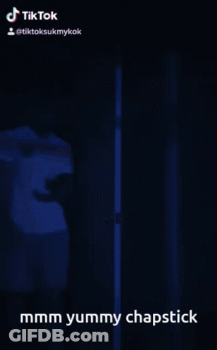 Person Standing In Doorway Saying Mmmm Yummy Chapstick GIF