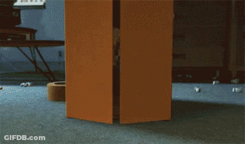 Person Standing In Doorway With TV Background GIF