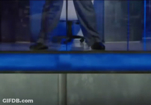 Person Standing In Front Of Blue Wall GIF