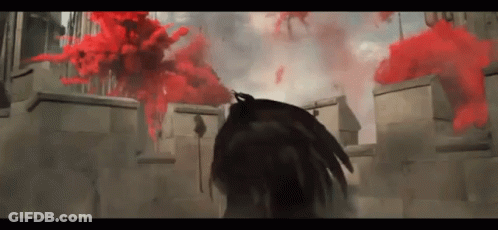 Person Standing In Front Of Building With Red Smoke GIF