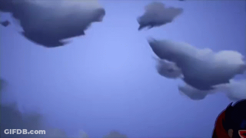Person Standing In Front Of Cloudy Sky GIF