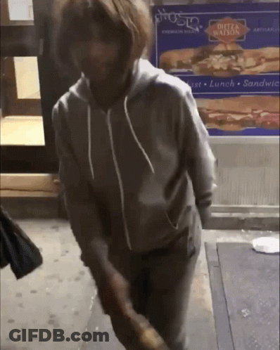 Person Standing In Front Of Dutz Station Sign GIF