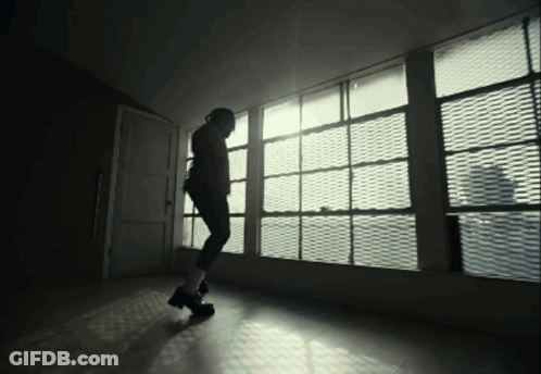 Person Standing In Front Of Large Window GIF