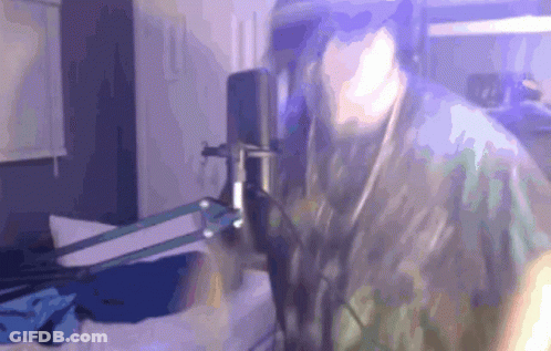 Person Standing In Front Of Microphone GIF