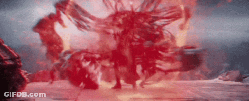 Person Standing In Front Of Red Explosion GIF