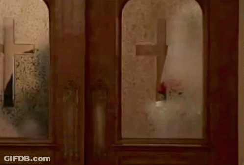 Person Standing In Front Of Window With Mirror GIF