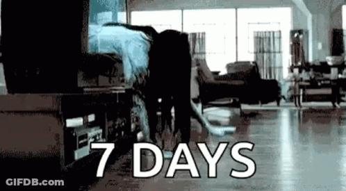 Person Standing In Living Room Saying 7 Days GIF