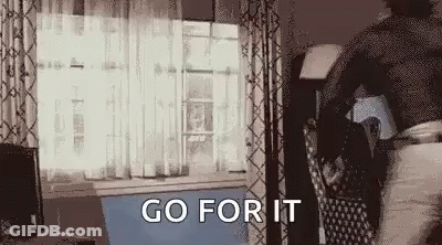 Person Standing In Living Room With Bag GIF