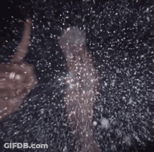 Person Standing In Pool Of Water With Bubbles GIF