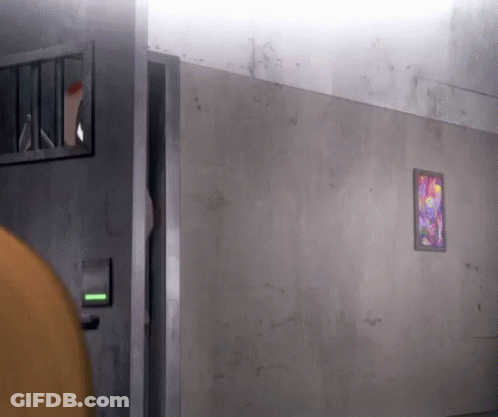 Person Standing In Prison Cell With Picture GIF