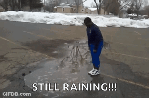 Person Standing In Puddle Saying Still Raining GIF