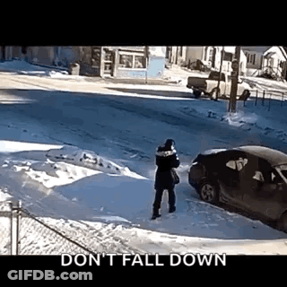 Person Standing In Snow In Front Of Car GIF