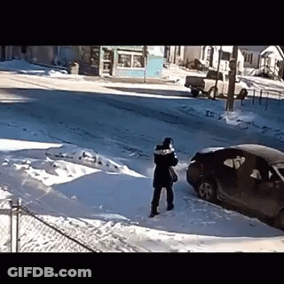 Person Standing In Snow Near Car GIF