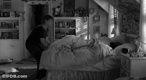 Person Standing Next To Bed GIF