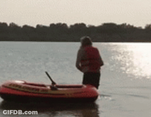 Person Standing Next To Raft Saying Rescue GIF