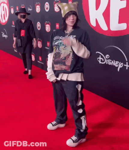 Person Standing On Disney Plus Red Carpet GIF
