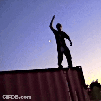 Person Standing On Red Container GIF