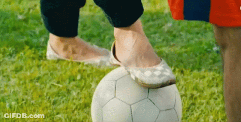 Person Standing On Soccer Ball GIF