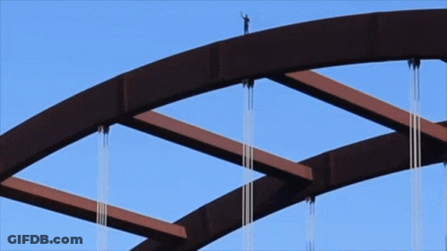 Person Standing On Top Of Bridge GIF