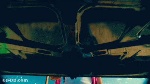 Person Standing Under Car Hood GIF
