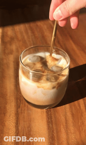 Person Stirring Iced Coffee With Spoon GIF
