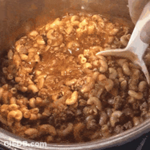 Person Stirring Macaroni And Cheese GIF