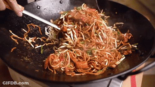 Person Stirring Noodles In Wok GIF