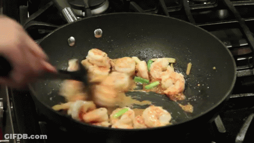 Person Stirring Shrimp In Pan GIF