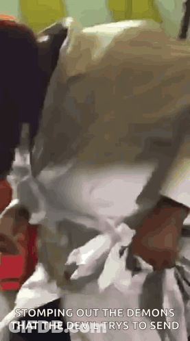 Person Stomping Out Demons From Devil GIF