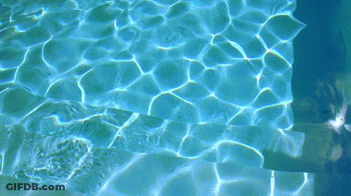 Person Swimming In Blue Pool GIF