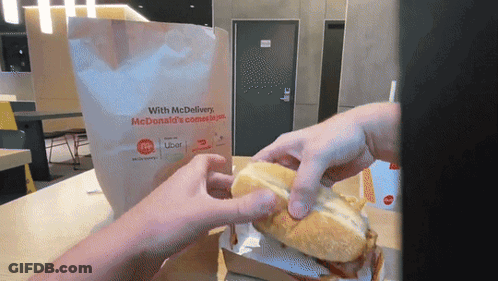 Person Taking McDonald's Sandwich Out Of Bag GIF