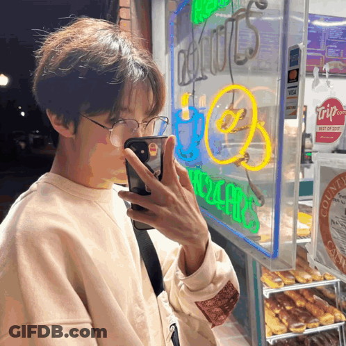 Person Taking Picture Of Donut Shop GIF