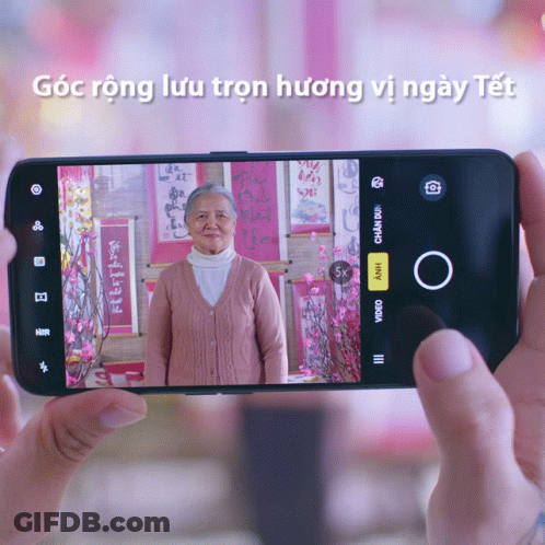 Person Taking Picture Of Elderly Woman On Phone GIF