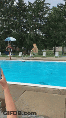 Person Taking Picture Of Swimming Pool With Umbrella GIF