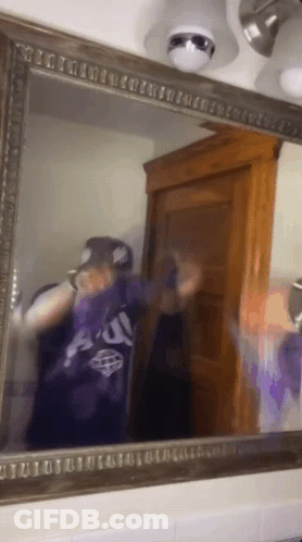 Person Taking Selfie In Mirror Wearing Au Shirt GIF