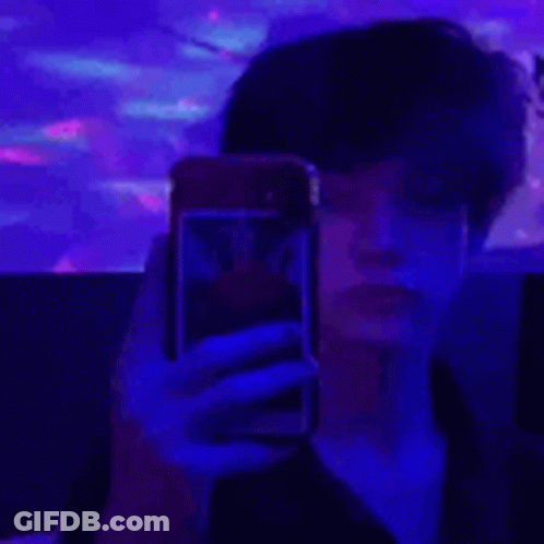 Person Taking Selfie On Purple Background GIF