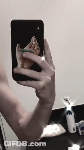 Person Taking Selfie With Phone GIF