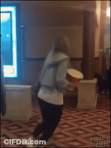Person Throwing Popcorn Bucket GIF